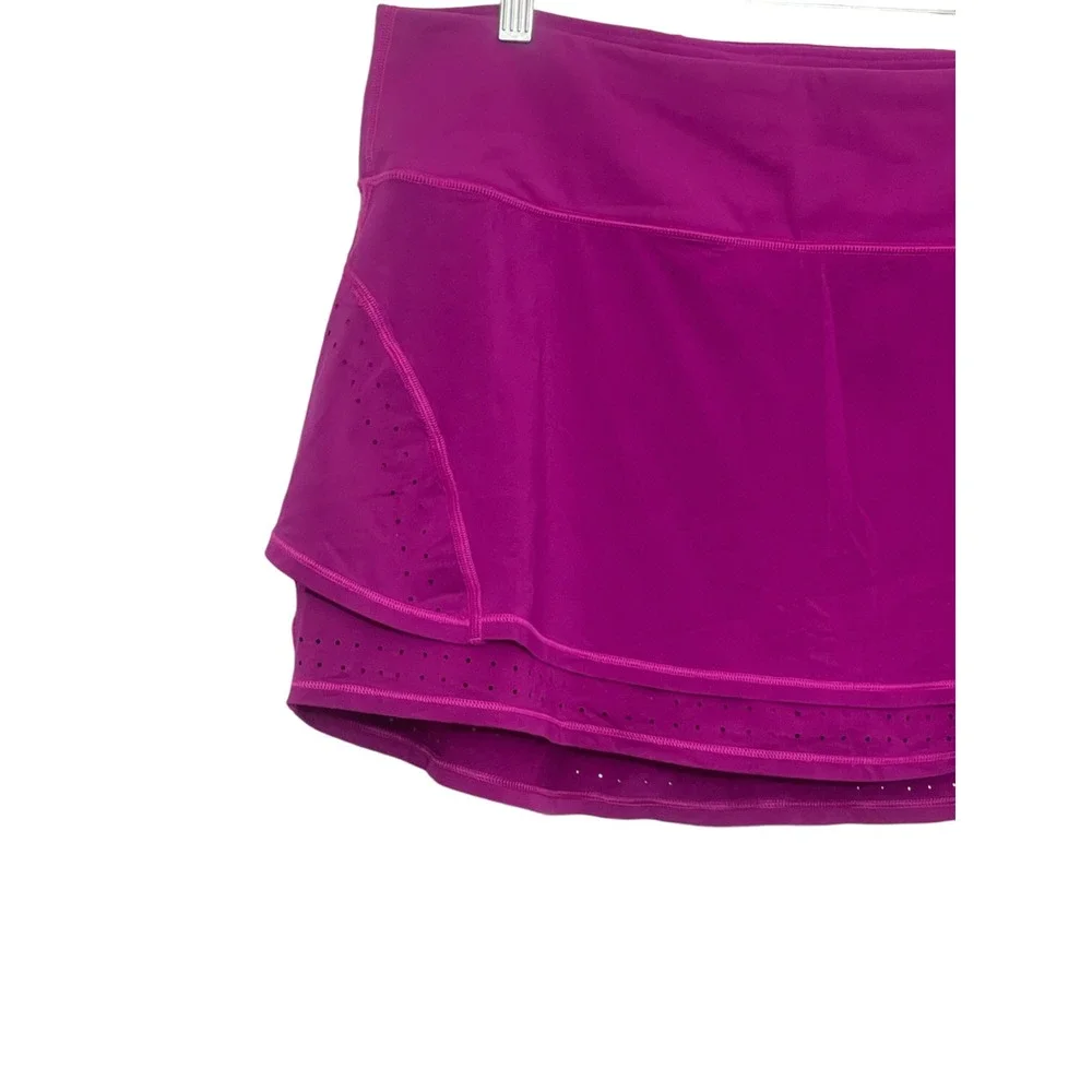 Athleta XL Fuschia Skort Pockets (two small‎ snags) See images